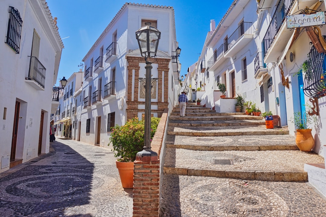 Frigiliana with parked cars in the foreground